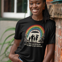 Load image into Gallery viewer, Conservatively Bold "We'll Teach Them" Cotton Crew Tee - Front of Tee on a female model leaning on a red brick wall