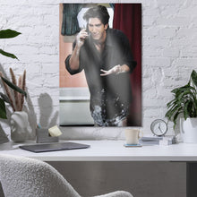 Load image into Gallery viewer, Framed artwork of a man on a white brick wall above a desk with decor items.