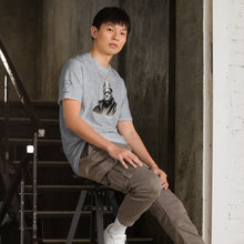 Load image into Gallery viewer, Legends of Hip Hop Biggie Smalls T-Shirt | Unisex Notorious BIG Tee Sport Gray on a male model sitting in a stairwell