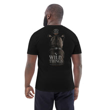 Load image into Gallery viewer, Man wearing a Mountain Lion Turquoise Jewelry Organic Cotton Tee 'WILD THINGS' on the back, standing against a white background.