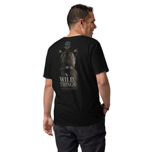 Load image into Gallery viewer, Man wearing a Mountain Lion Turquoise Jewelry Organic Cotton Tee and text on the back, on a white background.