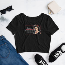 Load image into Gallery viewer, Retro Revelations Women’s Crop Tee | Conspiracy Theorist Design in black laying flat with shoes, sunglasses, jeans and a wallet

