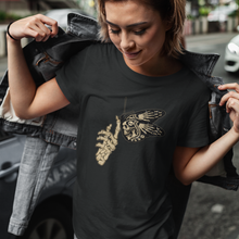 Load image into Gallery viewer, Young woman opening jacket to reveal a black T-shirt with a butterfly and skull design by VTown Designs