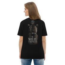 Load image into Gallery viewer, Woman wearing a Mountain Lion Turquoise Jewelry Organic Cotton Tee and text on the back, standing against a white background.
