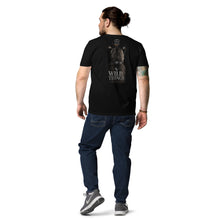 Load image into Gallery viewer, Man wearing a Mountain Lion Turquoise Jewelry Organic Cotton Tee and pants on a white background
